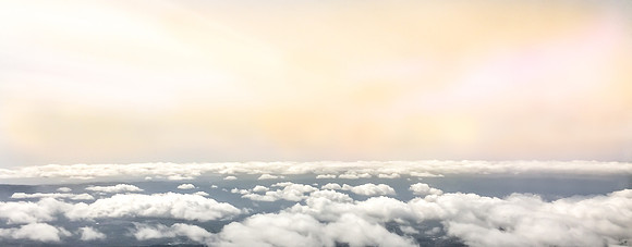 Soft clouds and sunset, seen from 35 thousand feet.